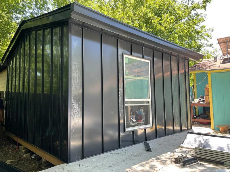 Black standing seam metal wall panels for Roof Inspection in East Camden