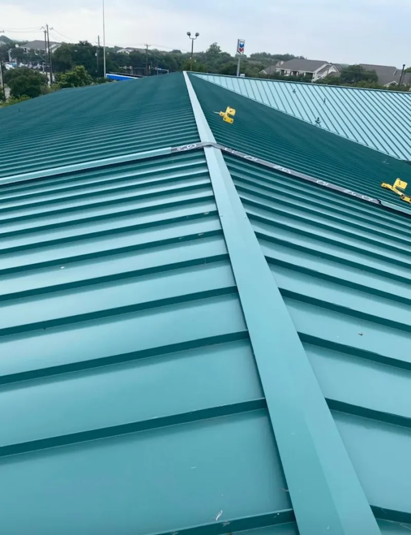 Green commercial metal roof ridge and valley for Metal Roof Repair in East Camden